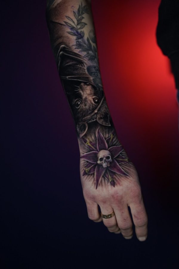 Wednesday Adams Nightshades and bat color and black and grey tattoo by Mihaly Forgony
